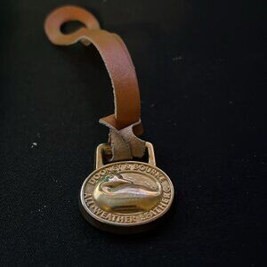 Dooney and Bourke Pendant and leather strap